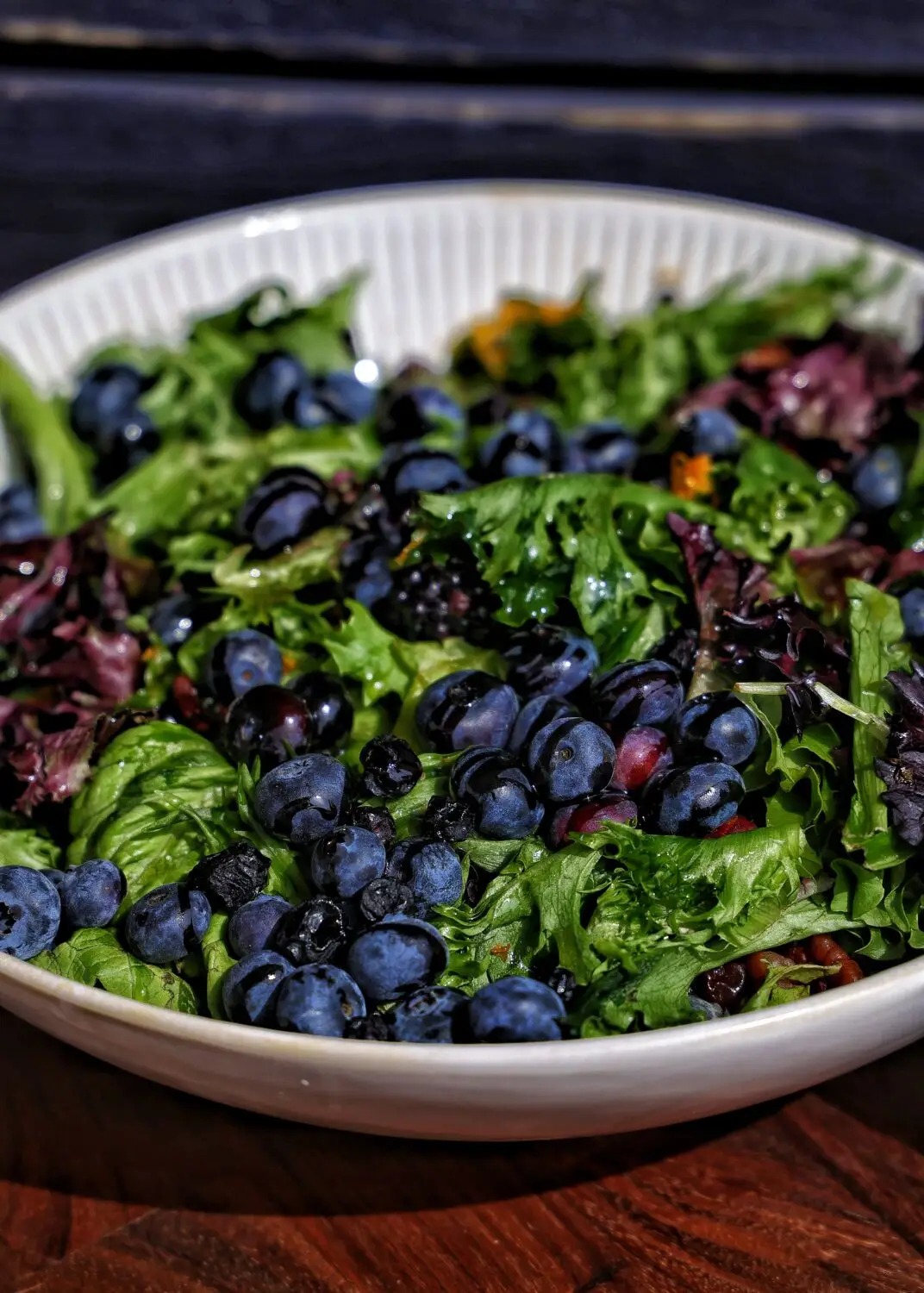 Black and Blueberry Spring Greens Salad: Simple, fresh and light. This salad combines fresh berries, toasted pecans, spring greens, and all finished with a tangy lemon-honey vinaigrette.