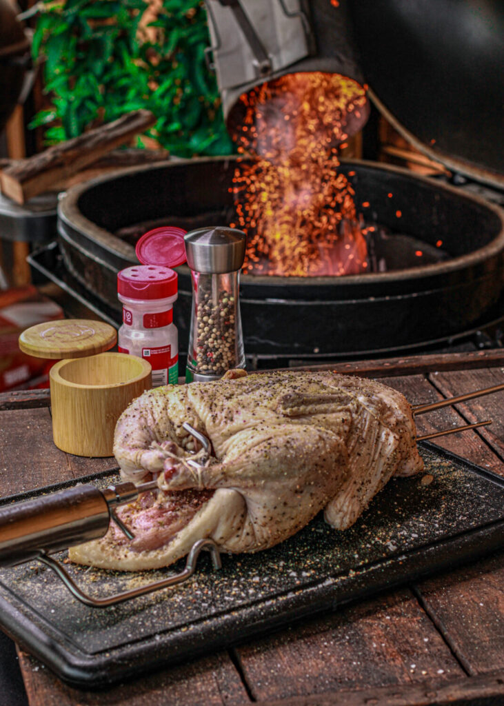 trussing and seasoning duck for rotisserie
