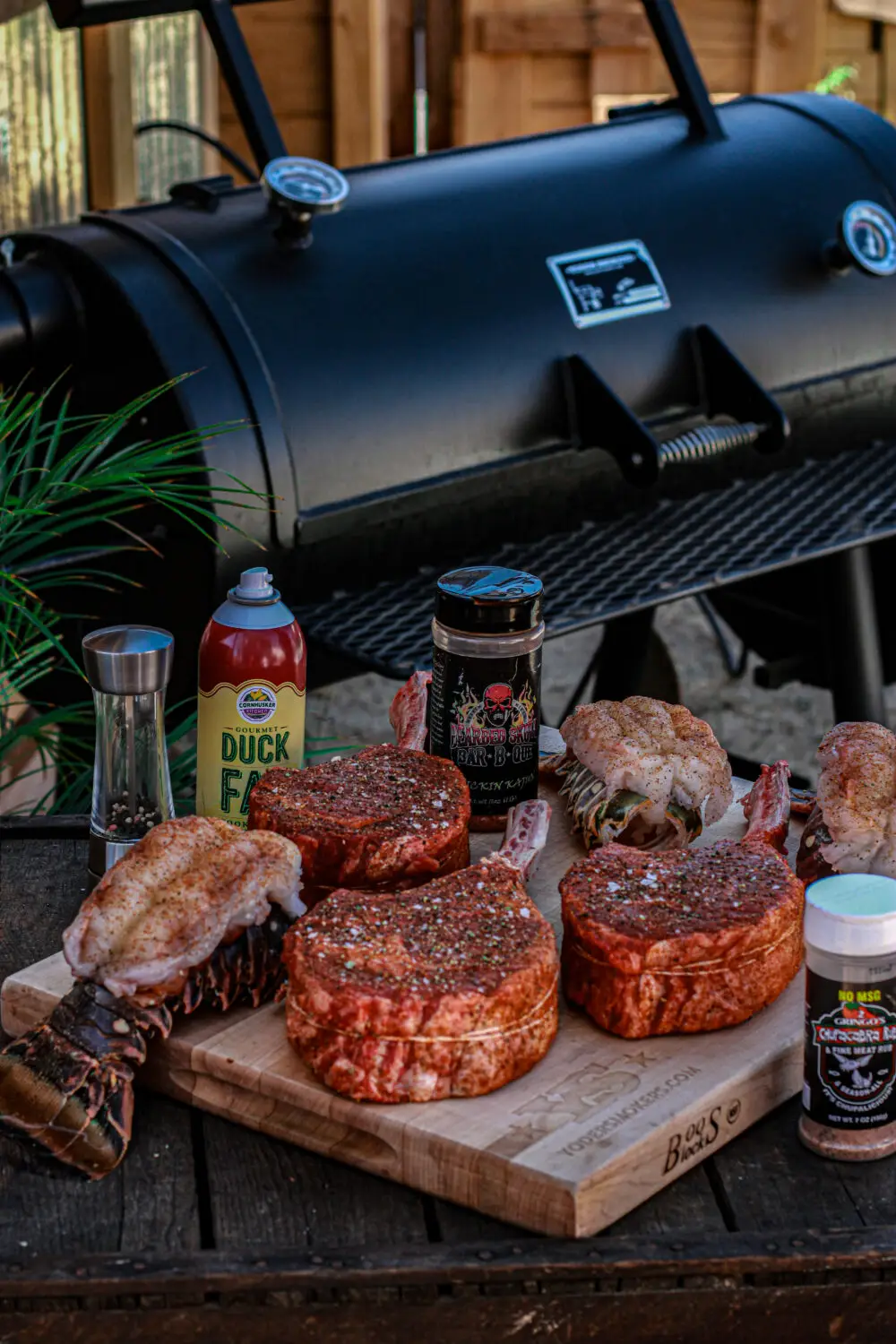 Seasoned steaks and lobster tails