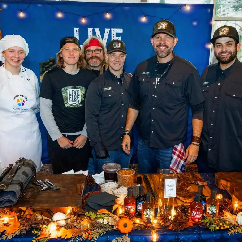 Live Fire Republic team at barbecue food display