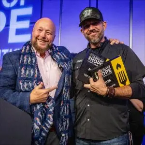 Two men pose with Taste of Hope competition awards.