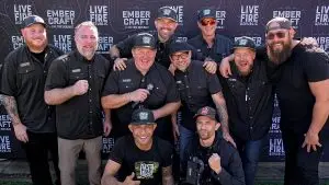Distorted group photo of men at Live Fire Republic backdrop